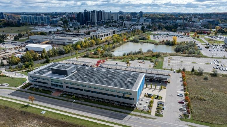 Aerial view of the sprawling modern commercial building at 420 Wes Graham Way.