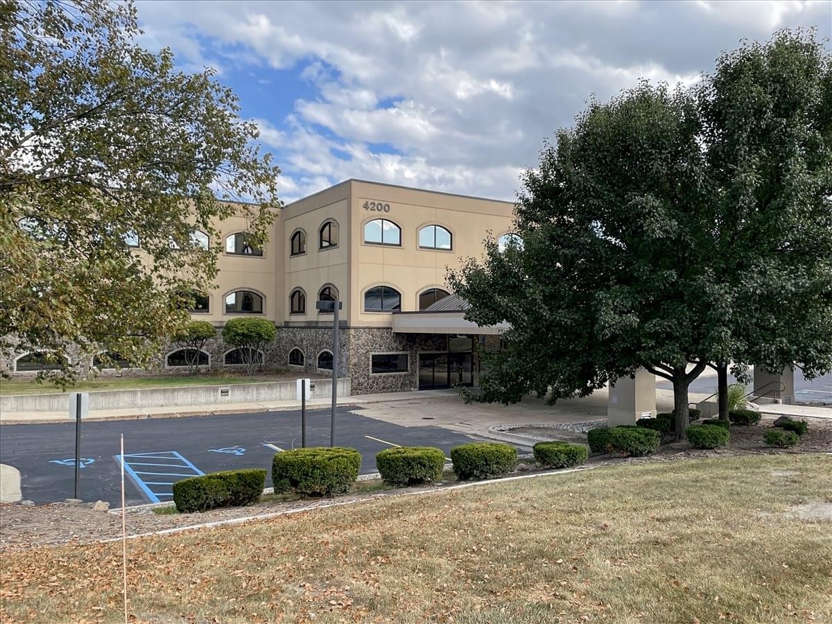 Exterior view of the tan brick building at 4200 Fashion Square Boulevard.