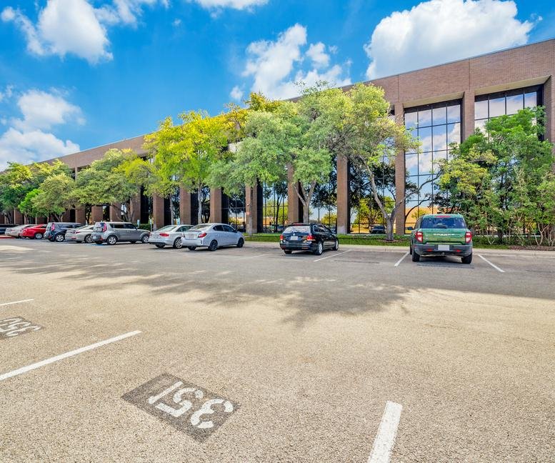 Exterior facade of the professional office building at 4440 S Piedras Dr with landscaped parking.