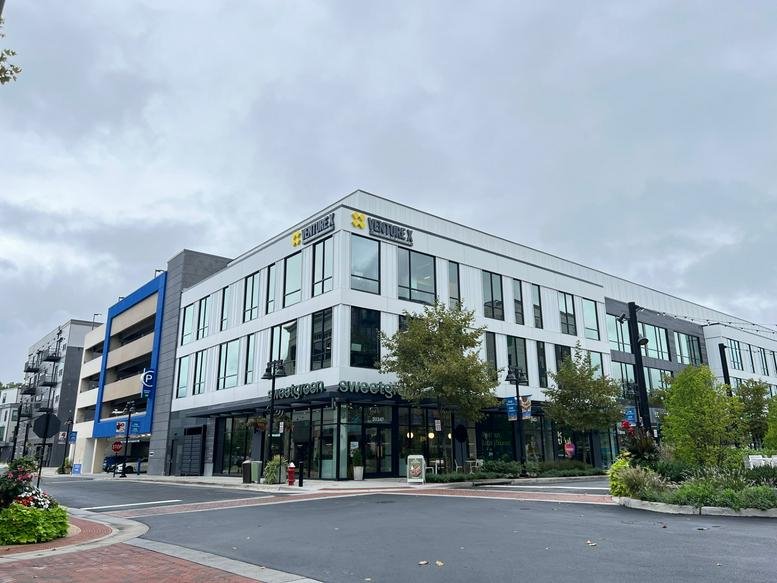 Exterior view of the modern, glass-fronted building at 44679 Endicott Drive.