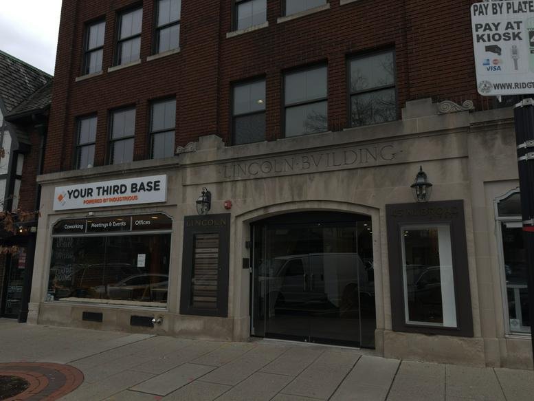 The exterior stone and brick facade of The Lincoln Building at 45 North Broad Street.