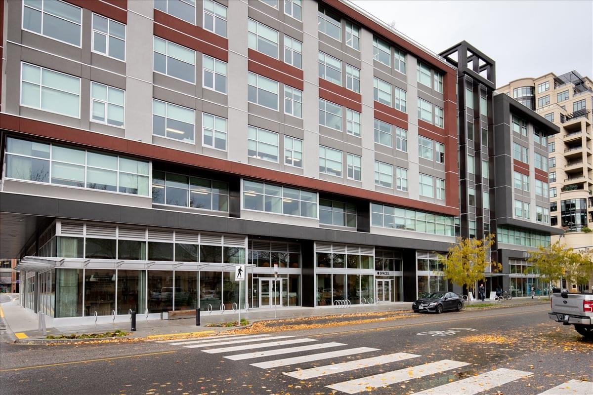 Exterior facade of the modern multi-story building at 460 Doyle Avenue, Unit 106.