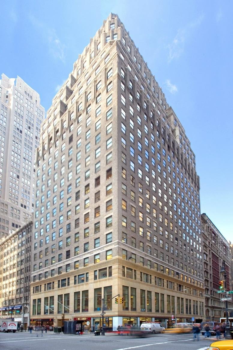 Exterior view of the classic stone facade building at 462 Seventh Avenue, FL 6.