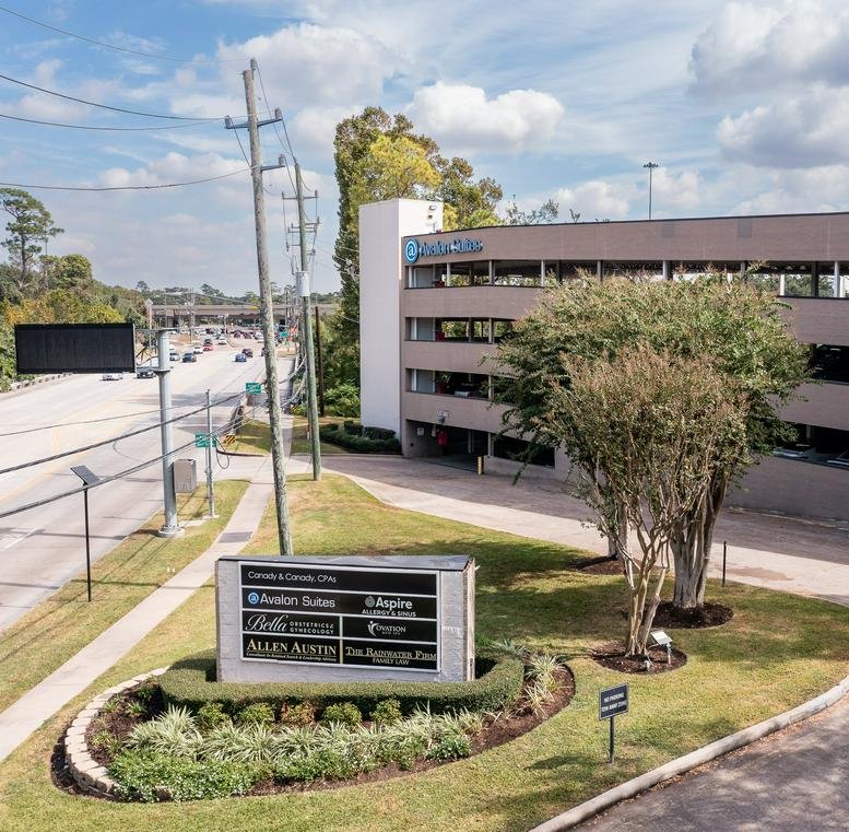 Exterior view of the multi-story office building at 4801 Woodway Drive.