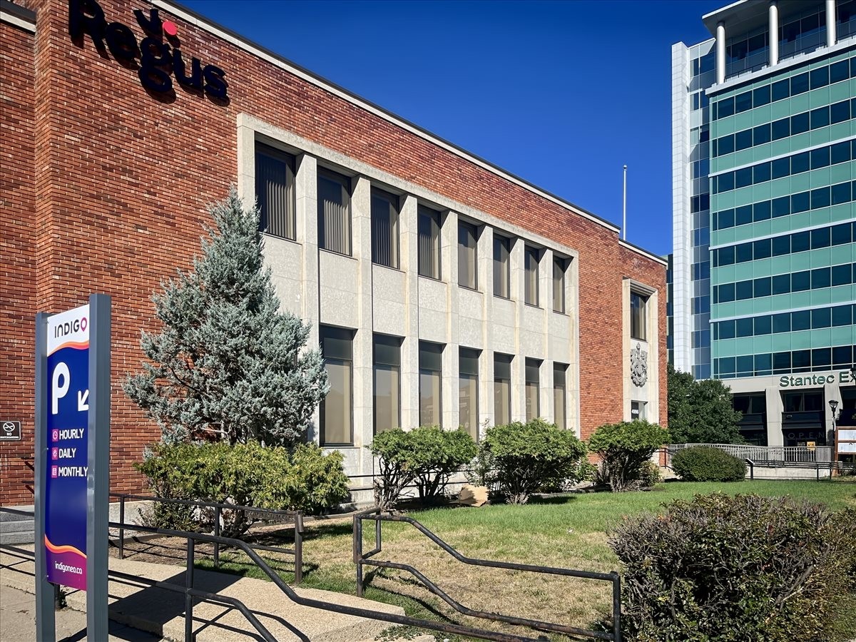 Exterior of Regus office building with brick facade and adjacent modern glass structure