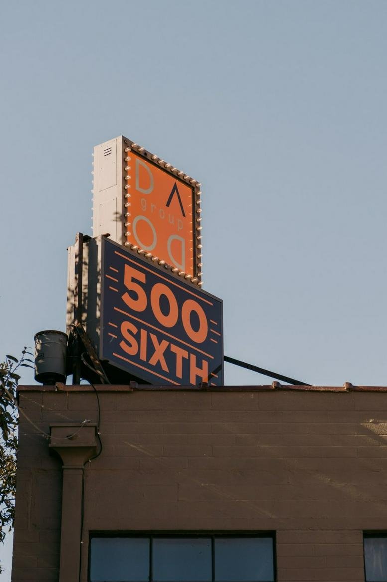 Exterior view of the building at 500, 6th Street, Downtown, San Antonio featuring a marquee-style sign.