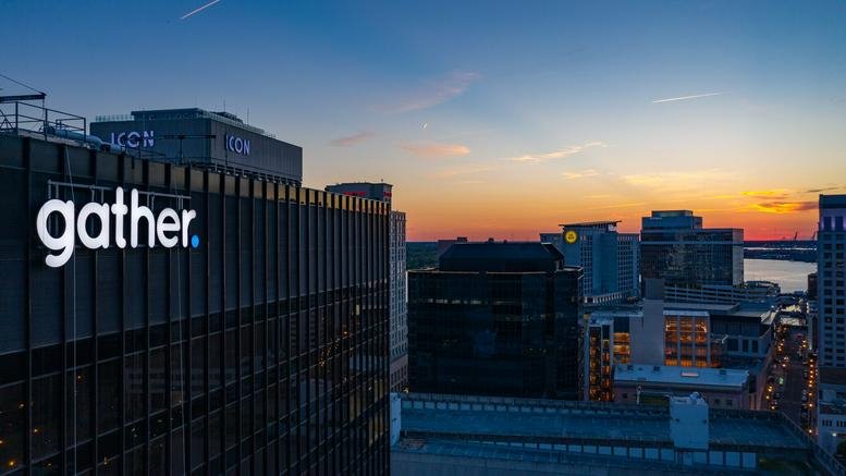 Exterior of 500 E Main Street, 16th Floor, Norfolk, Virginia showing the gather signage at sunset.