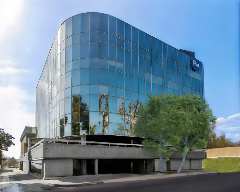 Exterior view of the curved glass-facade building at Brentwood Glen, 500 S. Sepulveda Blvd.