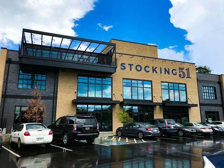 Exterior view of the brick facade at 5016 Centennial Boulevard Suite 200.