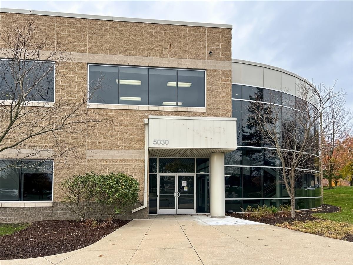 Exterior view of the brick and glass facade at 5030 Corporate Exchange Boulevard.