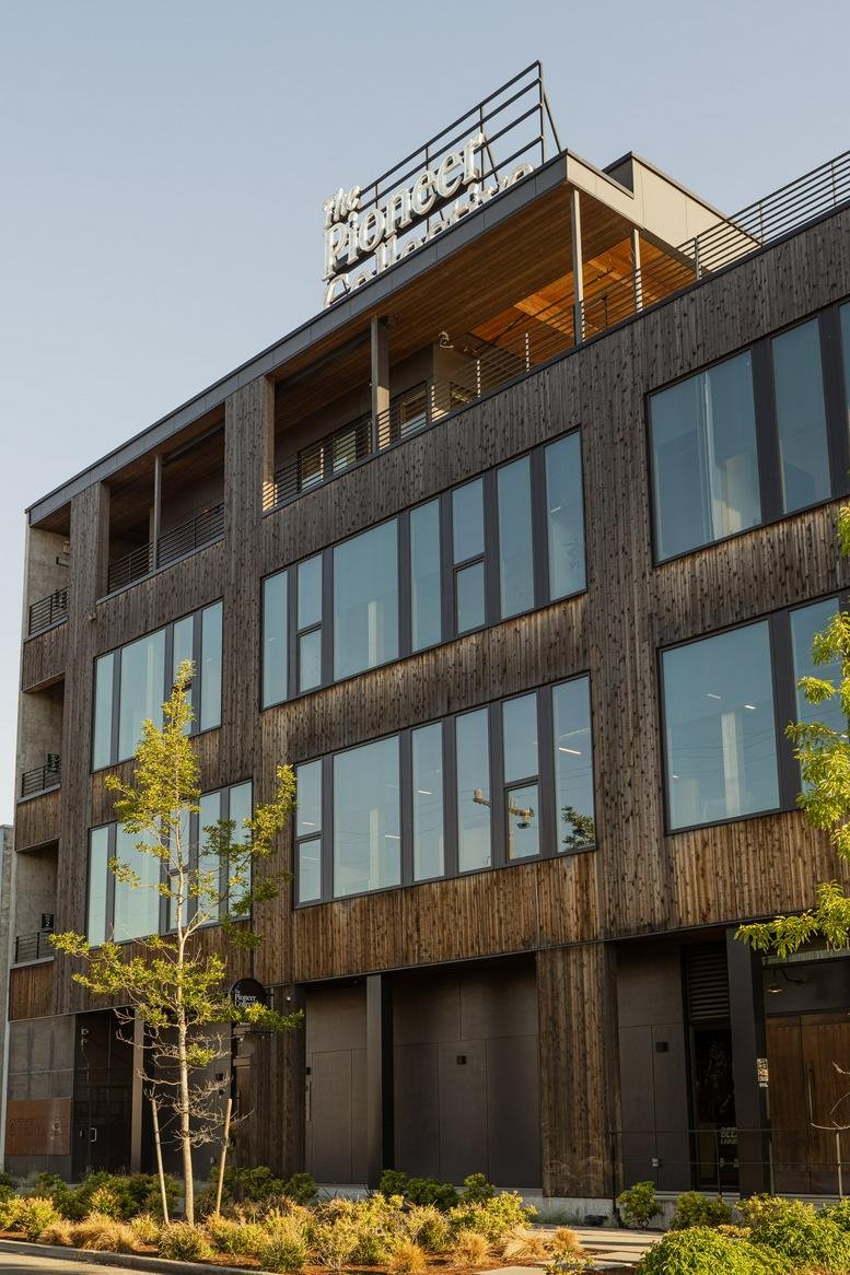 Exterior view of the wood-paneled Tommer Building at 5101 14th Ave NW.