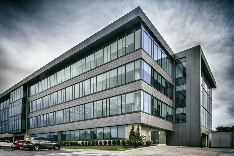 Exterior view of the contemporary glass and stone Creative Planning Plaza.