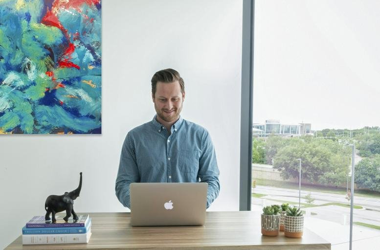 Exterior view of the glass and stone facade at Creative Planning Plaza.