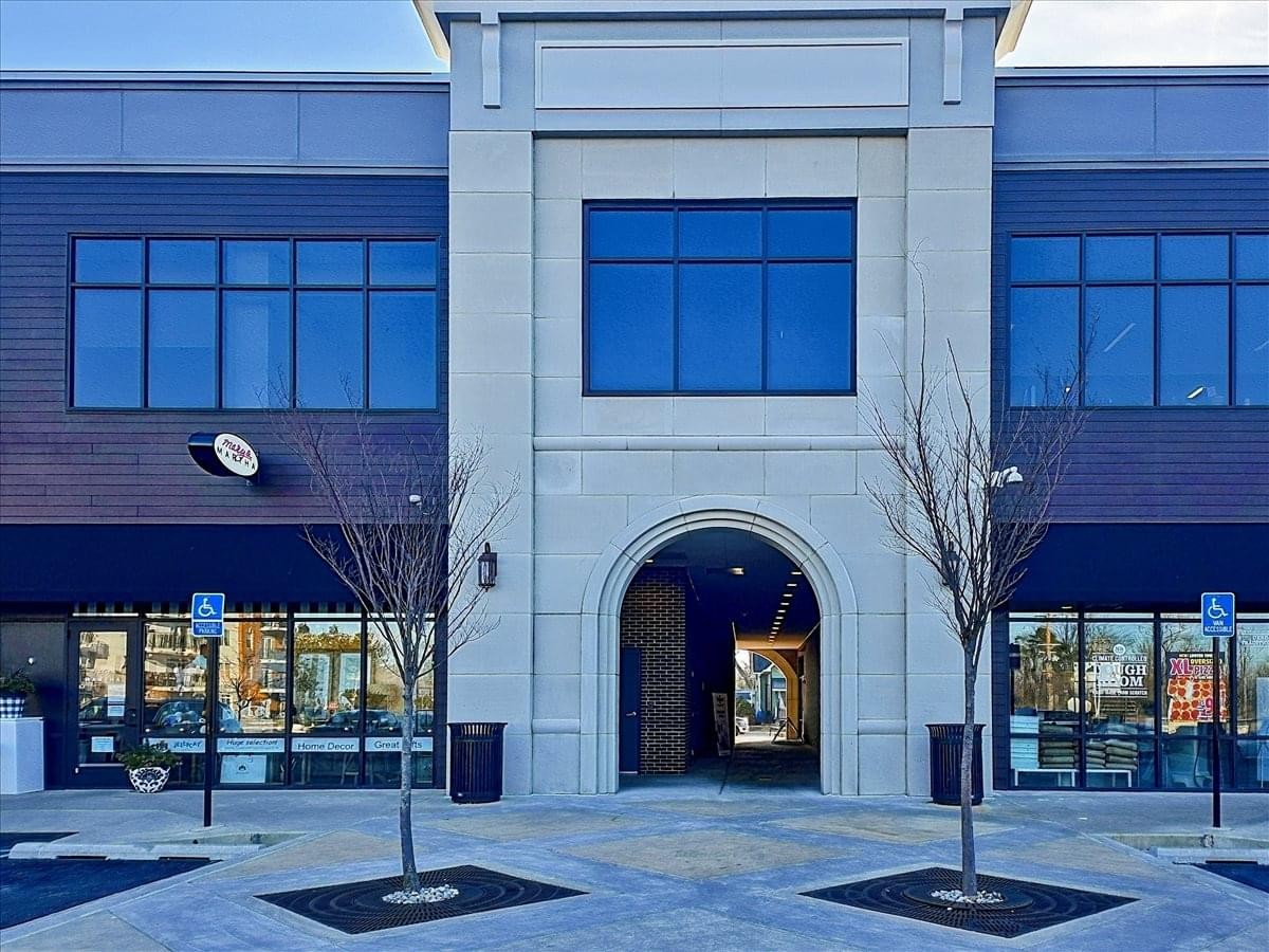 Exterior entrance of the modern two-story brick and stone building at 5724 Green Street.