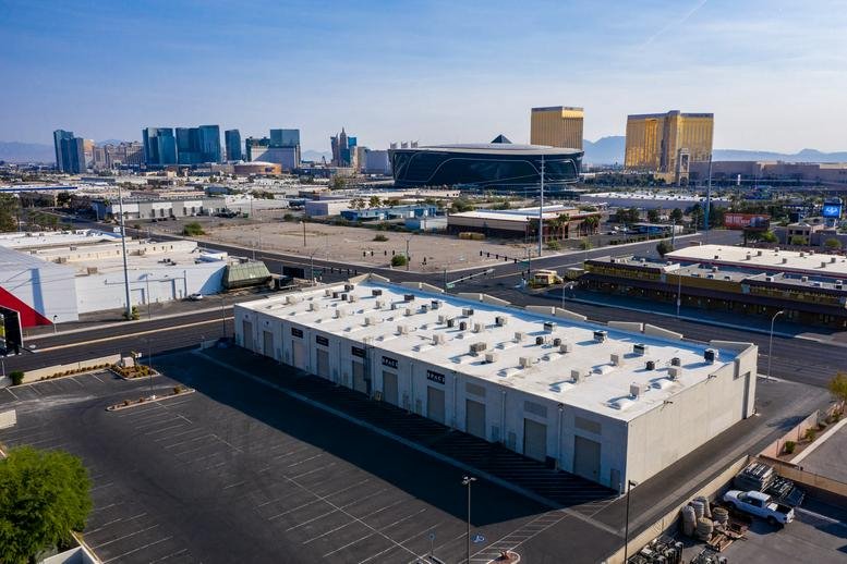 Aerial view of the light-colored industrial building at 5725 South Valley View Boulevard, Suite 7.