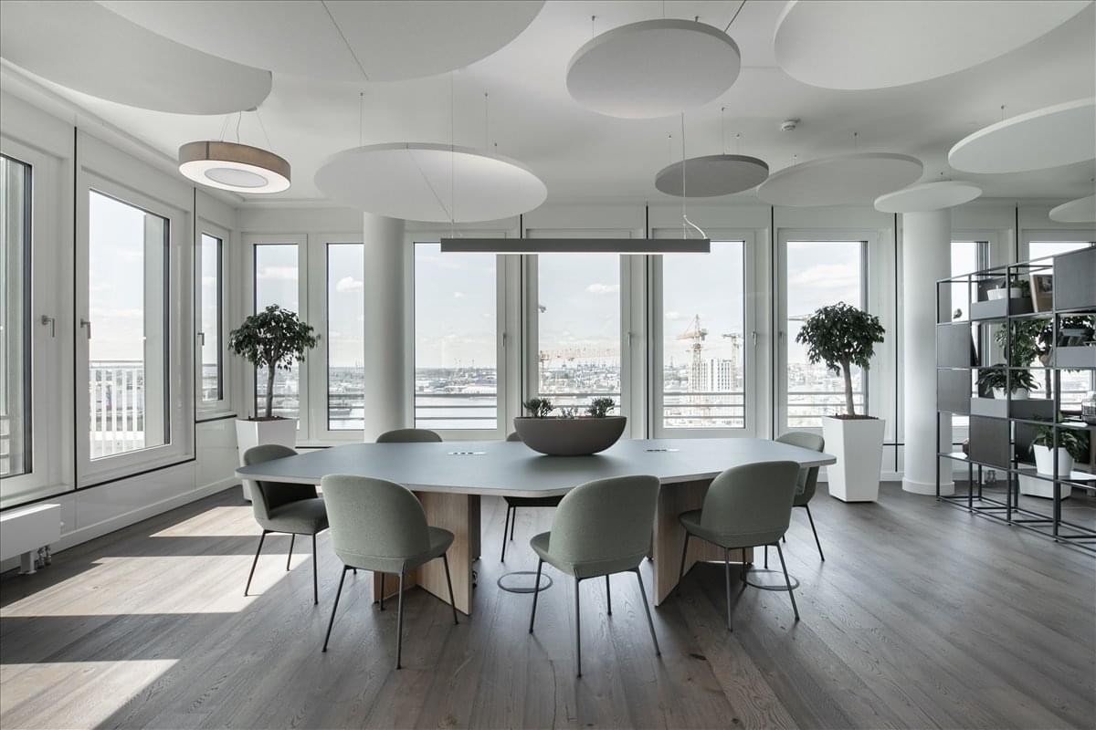 Spacious communal area at 600 Massachusetts Avenue Northwest with designer lighting and window views.