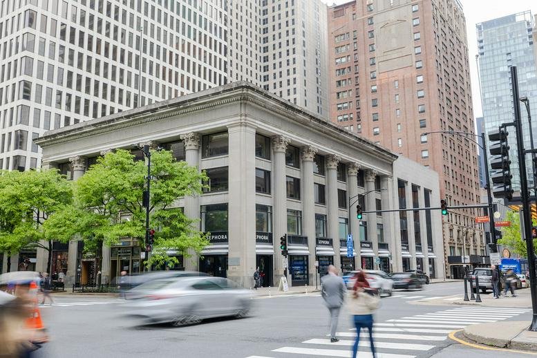 Exterior view of the historic stone building at 605 North Michigan Avenue.