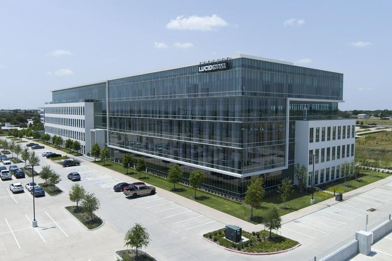 Exterior view of the contemporary glass and steel building at 6275 West Plano Parkway.