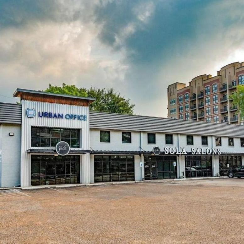 Exterior view of the multi-tenant Heights Common building with prominent Urban Office signage.