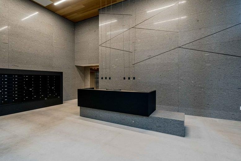 Sleek, modern lobby and reception at 1281 Hornby Street, 6th Floor with geometric wall patterns.