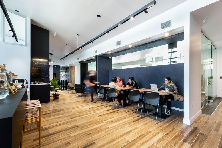 Spacious communal lounge and café area at 65 Rue Principale, Châteauguay, Quebec.