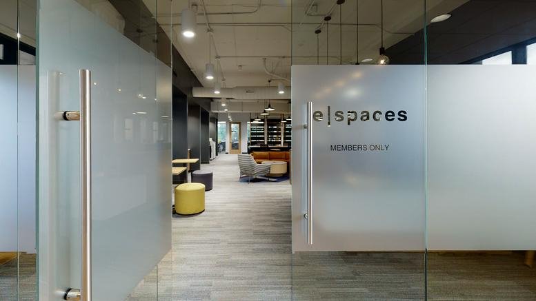 Frosted glass entrance doors leading into the main common area of 651 E. 4th Street, Chattanooga, Tennessee.