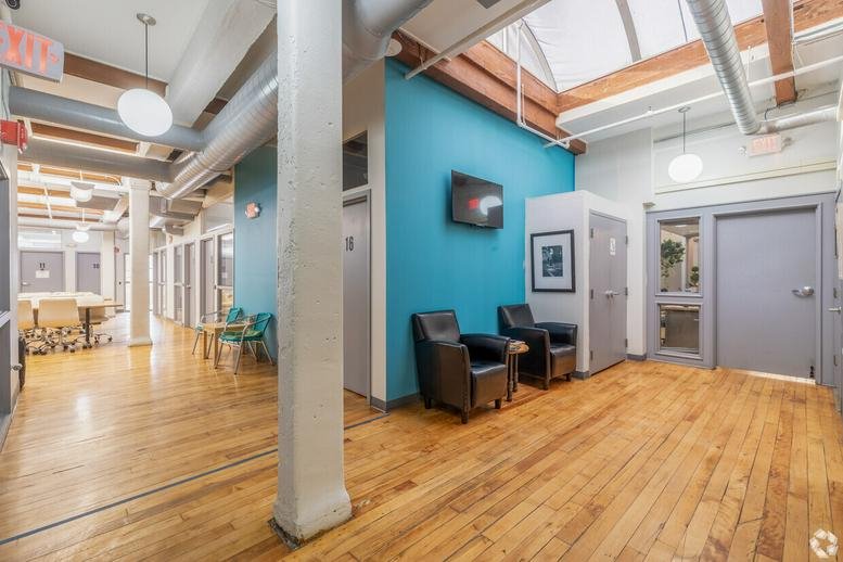 Common area at 68 Harrison Avenue, 6th floor featuring a blue accent wall and skylights.