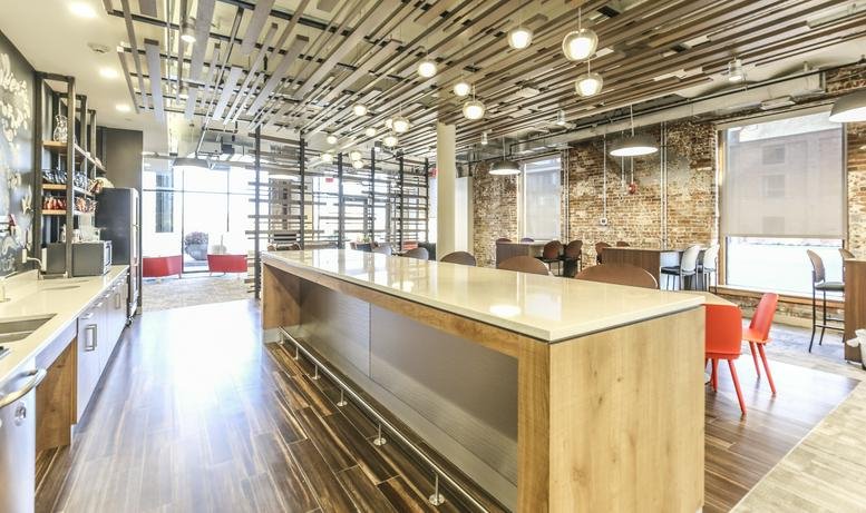 Communal area with long table and bright lighting.