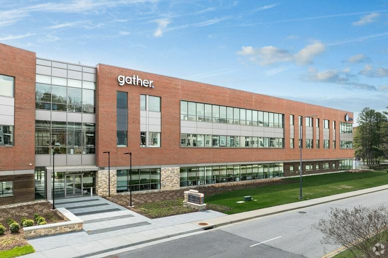 Exterior view of the brick and glass facade at 700 Tech Center Parkway, Suite 200.