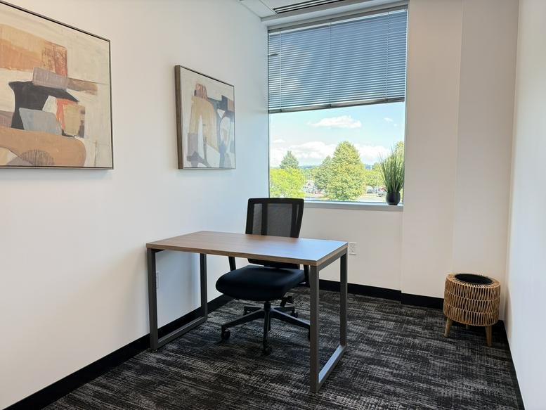 Modern reception area at 7100, Guilford Drive, Suite 200 with wood paneling and branded signage.