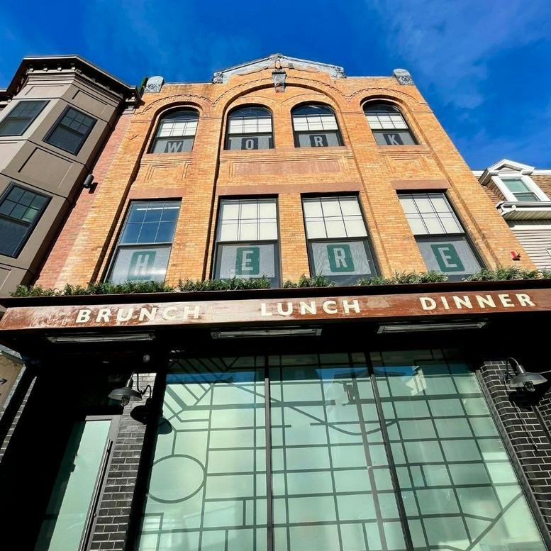Exterior view of the brick facade and restaurant entrance at 732 East Broadway, Boston, Massachusetts.