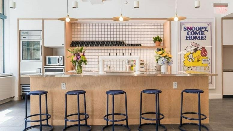 Spacious communal kitchen and cafe area at 75 Arlington Street, Back Bay, Boston, Massachusetts.