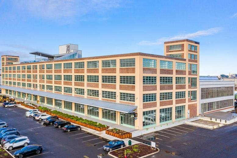 Exterior view of the industrial-style brick facade at 78 John Miller Way, (KPT) Suite 326.