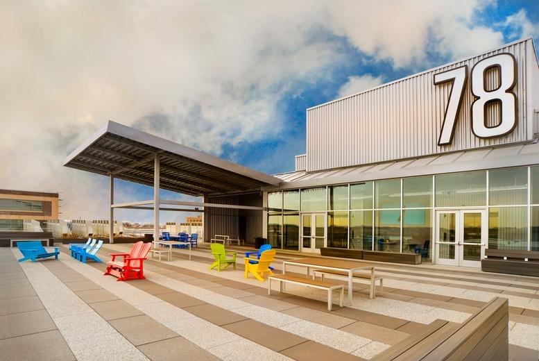 Exterior view of the modern industrial-style facade at 78 John Miller Way.