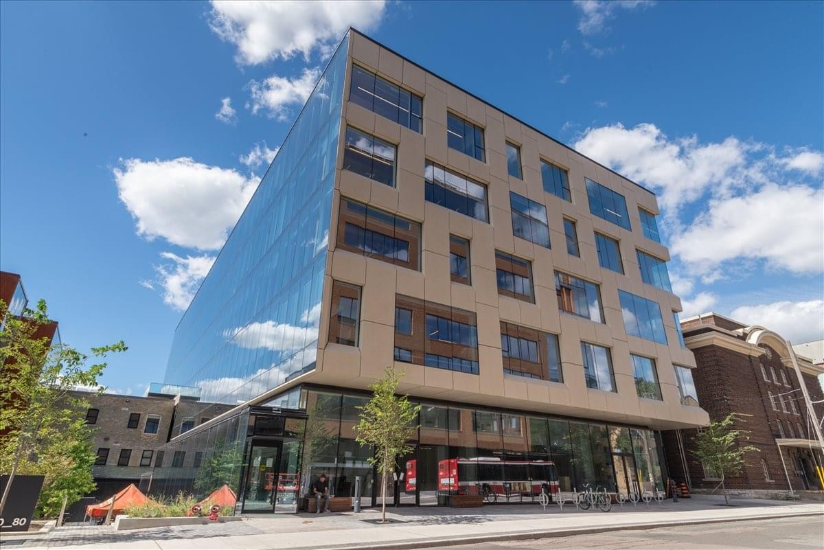 Exterior view of the modern wood and glass facade at 80 Atlantic Avenue.