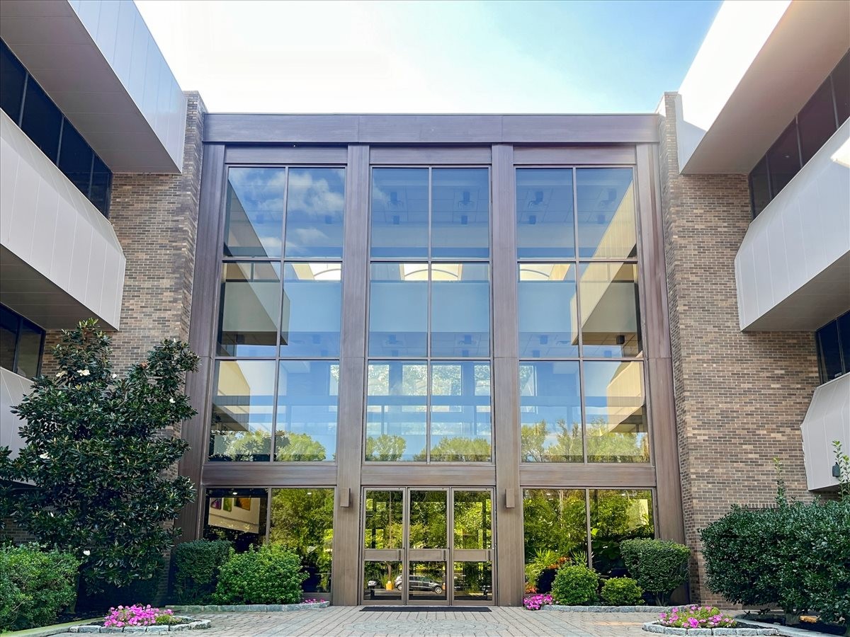 Exterior view of the multi-story glass and stone entrance at 800 Kinderkamack Road, 2nd Floor, Oradell, New Jersey.
