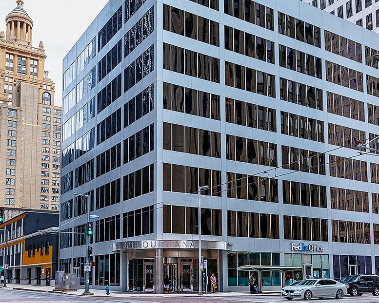Exterior view of the multi-story professional building at 801 Louisiana Street with modern glass windows.