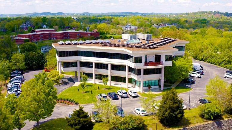 Aerial exterior view of the multi-story office building at 810, Dominican Drive, Nashville, Tennessee.