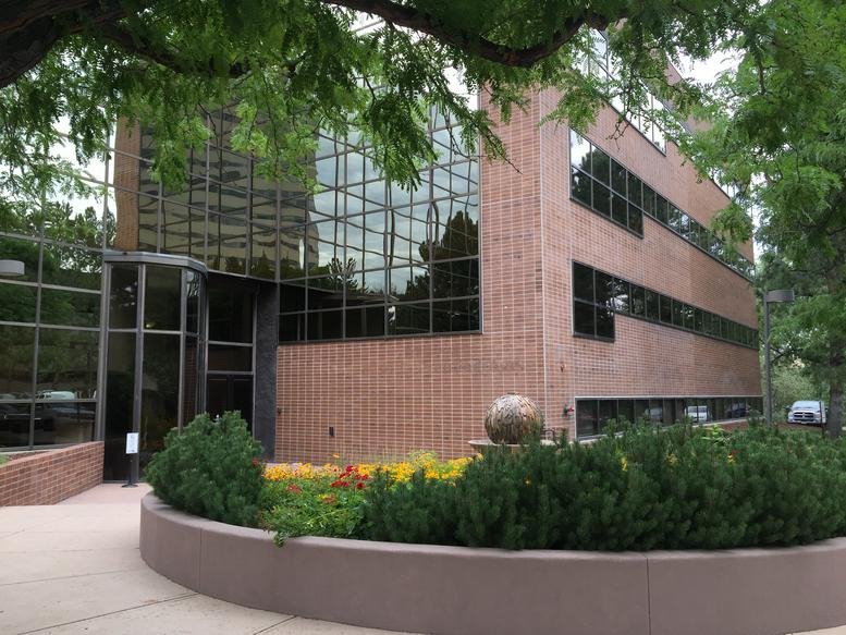 Exterior view of the brick and glass office building at 8301 E Prentice Avenue, DTC.
