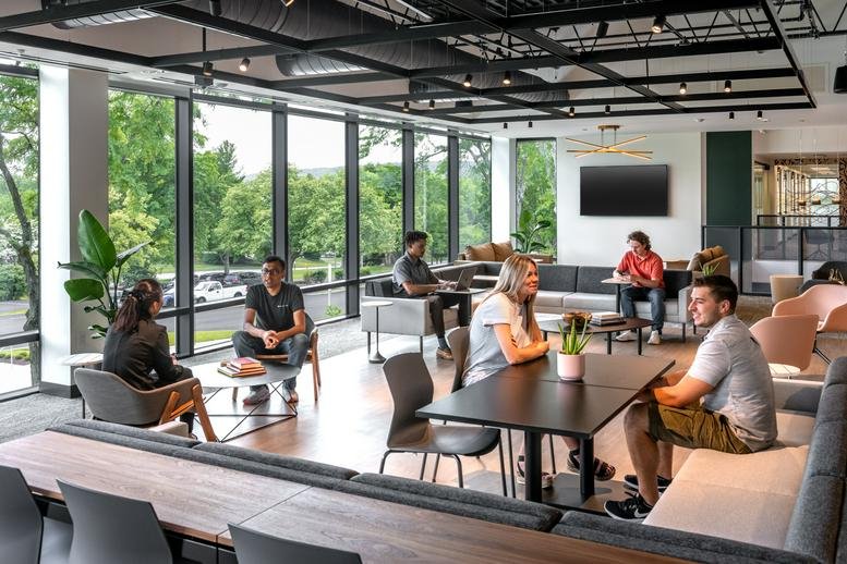 Spacious communal lounge at 851 Duportail Road, 2nd Floor, Chesterbrook with floor-to-ceiling windows.