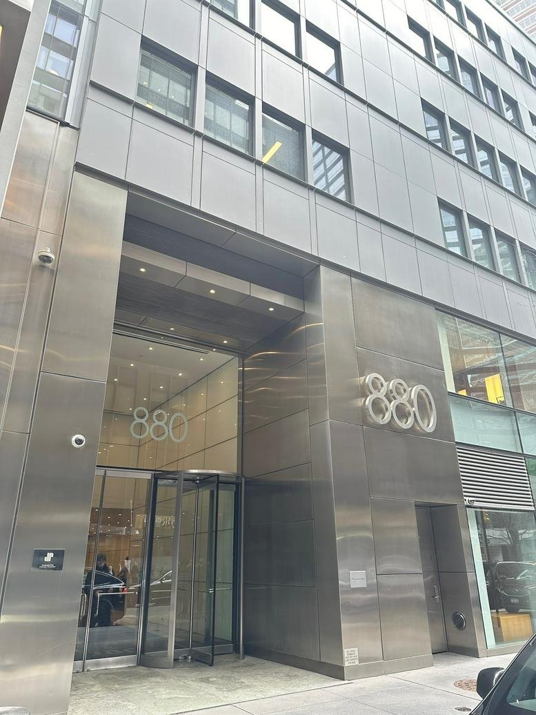 Entrance to the building lobby featuring the 880 address signage.