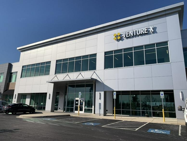 Exterior view of the modern glass and metal building at 8865 Stanford boulevard, Suite 202, Columbia (Maryland).