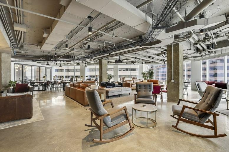 Spacious communal lounge at 900 19th Street Northwest, Floors 5 and 6, Washington DC with modern rocking chairs.