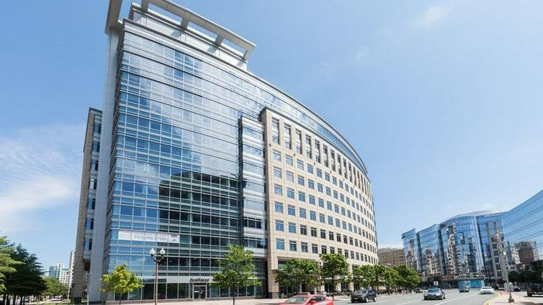 Modern glass and stone exterior of the 901 North Glebe Road, Ballston building.