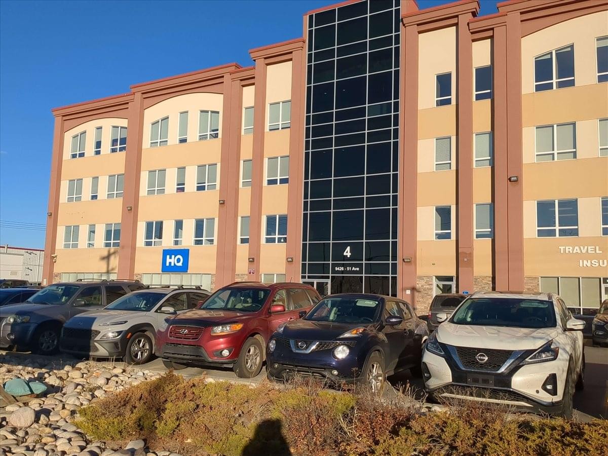 Exterior view of the professional brick and glass building at 9426 51 Avenue North West, No. 2.