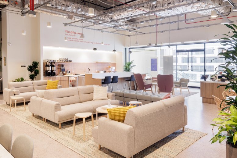 Spacious communal lounge and cafe at 945 Market Street, San Francisco, California featuring modern sofas and plants.