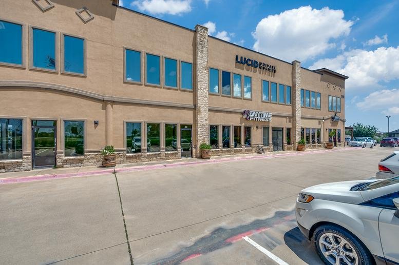 Exterior view of the tan brick building at 9500 Ray White, Suite 200, Fort Worth, Texas.