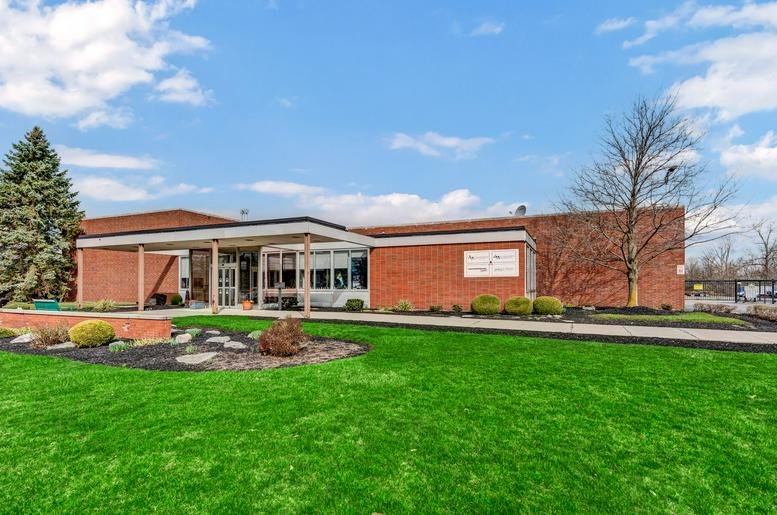 Exterior view of the brick facade and entrance at 9580, Main Street, Clarence.
