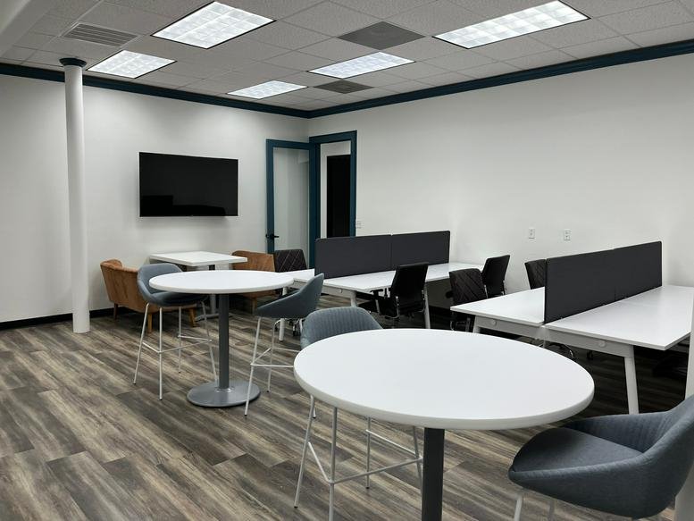 Spacious open-plan lounge and coworking area at 96 Beach Walk Boulevard Conroe, Texas.