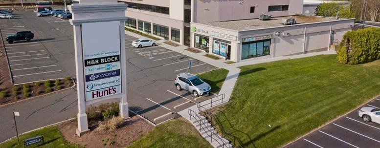 Exterior view of the office building and signage at 98 Lower Westfield Road, Holyoke, Massachusetts.